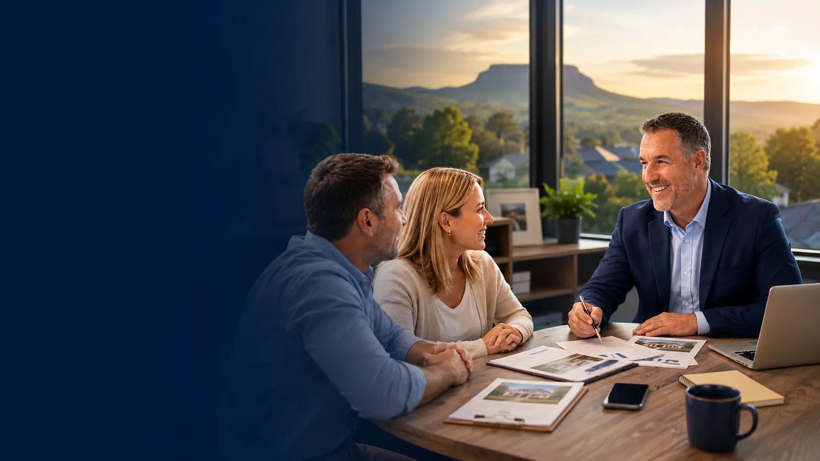 Bill Layne, owner of Bill Layne Insurance Agency, helping North Carolina clients compare insurance coverage in his Elkin office